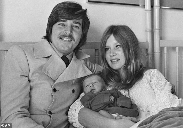 In his personal life, Sherman welcomed two sons called Tyler and Christopher in the 1970s with his first wife Patti Carnel; pictured in 1972 with Carnel and baby Christopher