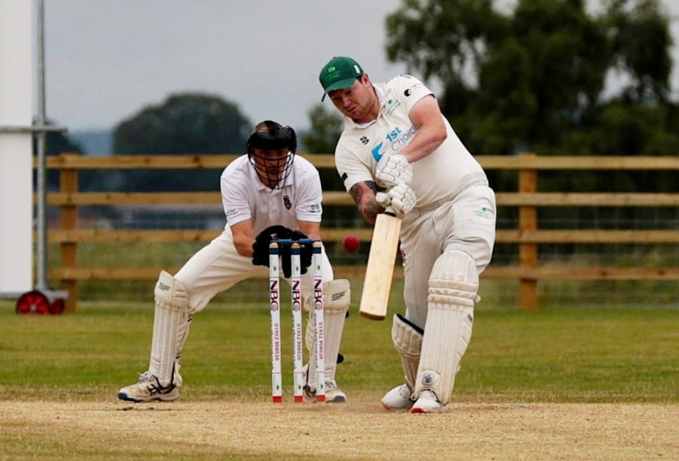 A leg amputee playing cricket.