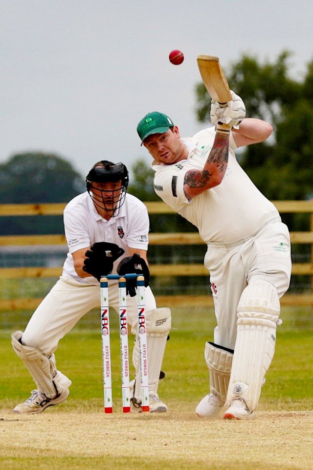 A leg amputee playing cricket.