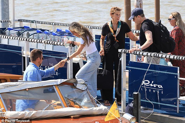 Guests Sandra Leong and Robert Gelfond arriving getting on to a boat after arriving in Venice for the wedding