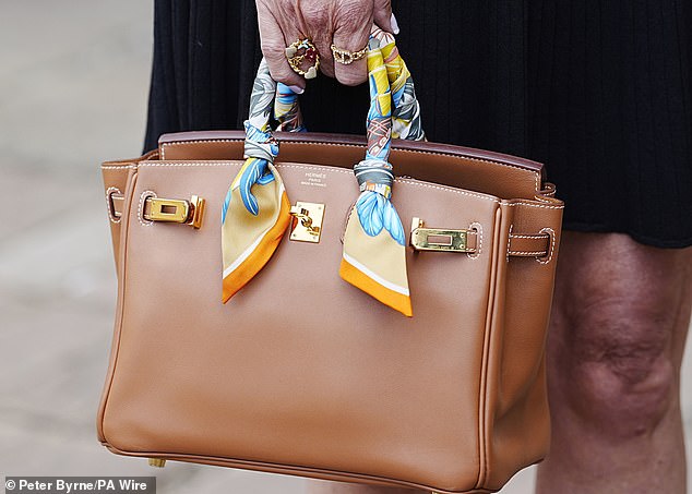 Ms Colbert carried a Hermes handbag to court with her as Watkin dramatically changed his pleas