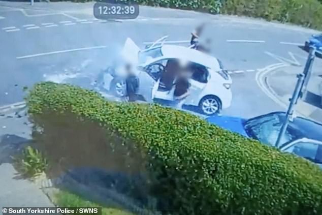Kelsall and three fellow passengers are spotted ignoring the woman's crushed car completely, calmly collecting some £20 notes strewn among the rubble