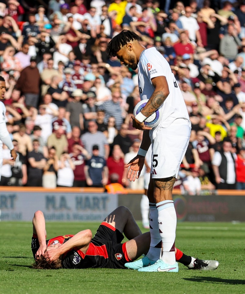 Soccer player on the ground after a collision.