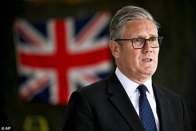 Britain's Prime Minister Keir Starmer talks to the media after visiting the Netherlands marines training base