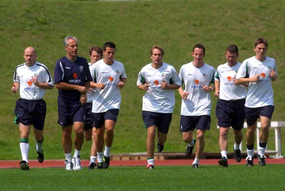 Mick McCarthy and the Republic of Ireland soccer team jogging during a training session.