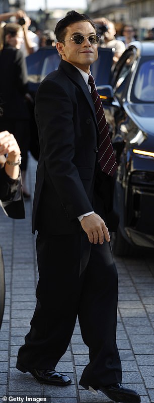 He added a pair of shiny smart loafers