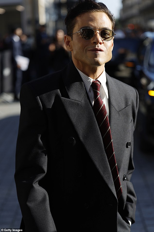 The actor, 44, accessorised with a burgundy striped tie and Aviator style shades