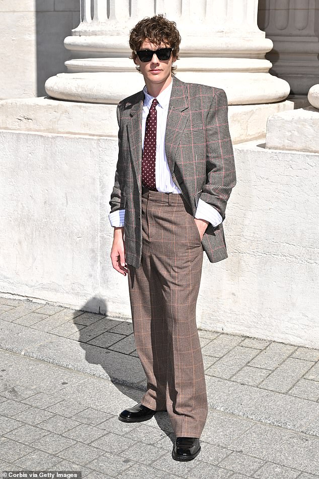 Hunter Doohan looked stylish in brown tweed trousers and a grey tweed blazer jacket