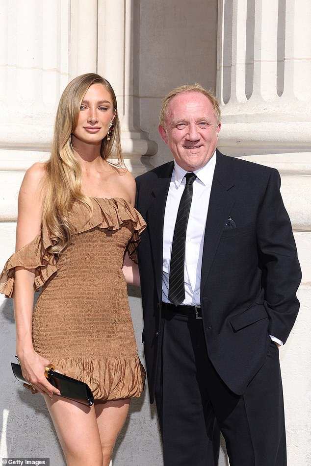 Mathilde put on a very leggy display in the mini dress as she posed beside her father, 63