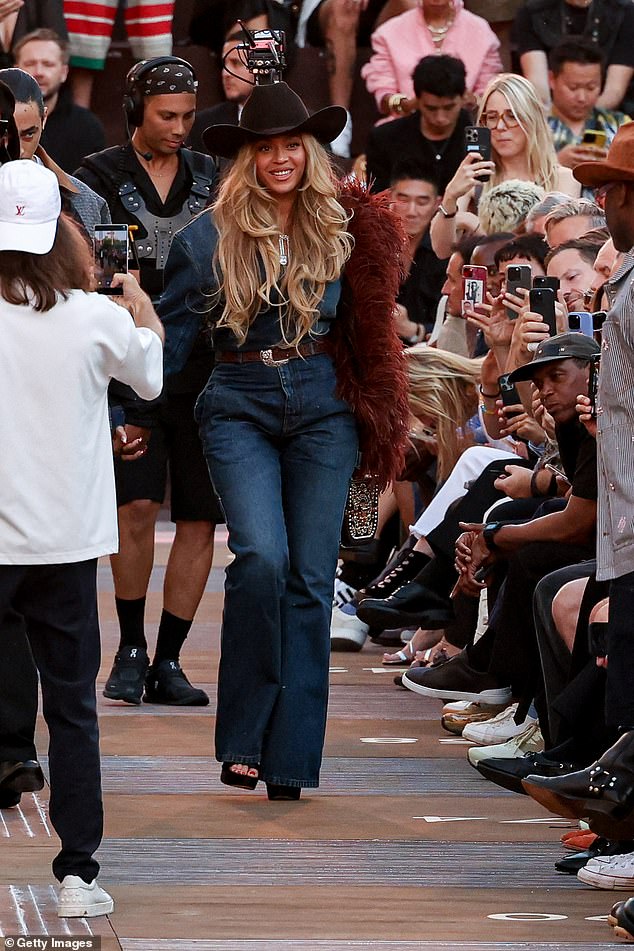 Beyoncé continued to embody her favourite country-chic aesthetic, teaming a blue denim shirt with matching wide-legged jeans and a chunky brown leather belt