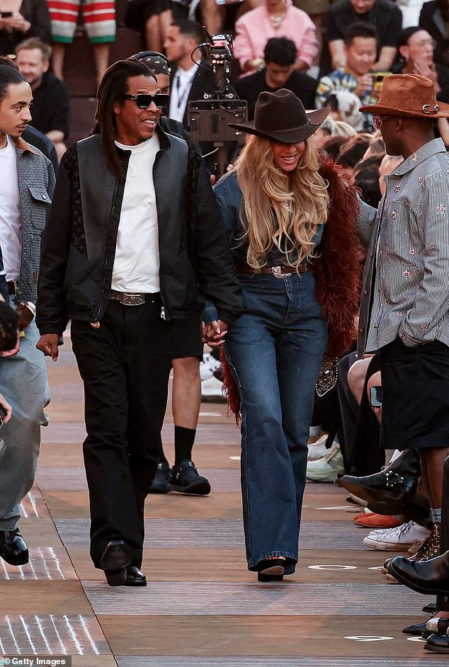 While Jay-Z showed his support for the French fashion house in a black Saint Laurent leather jacket, over a plain white t-shirt and jeans