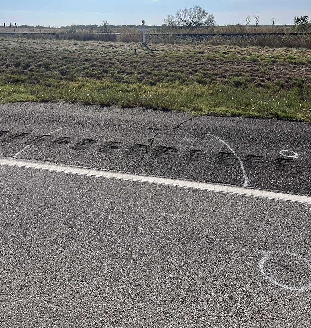 Presgrove's body was found between the two chalk lines, and teeth within the circles. In the background is a memorial set up for the teenager