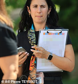 Beatrice Bavato with a checklist of the rich and famous