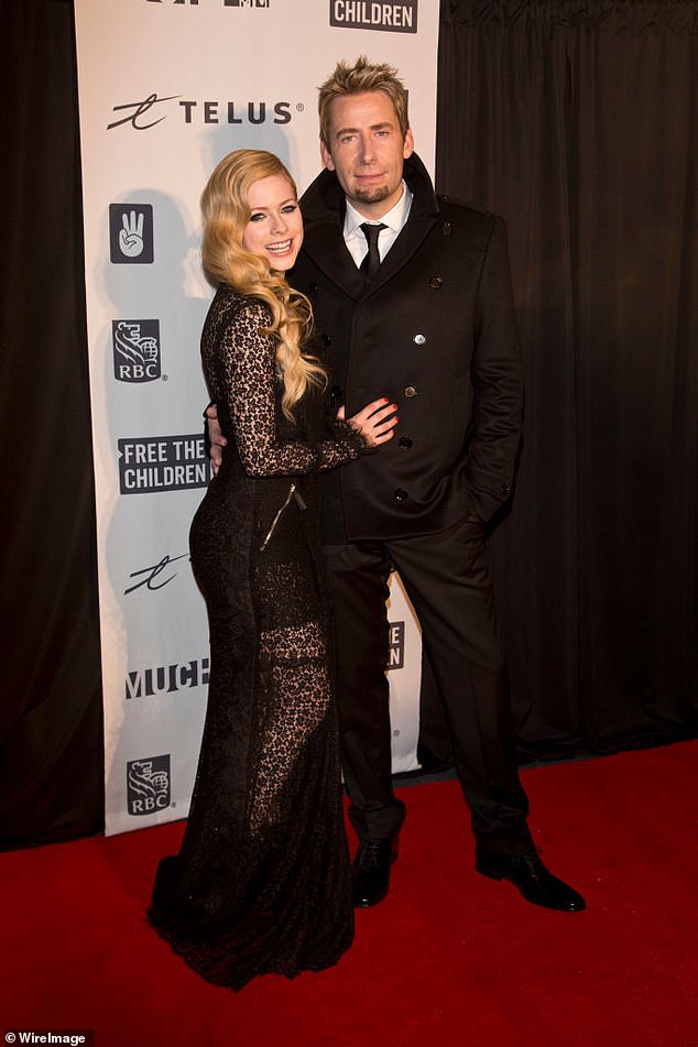Avril Lavigne and Nickelback rocker Chad Kroeger said their vows while standing in a medieval castle in the South of France as red backlighting illuminated their goth-themed wedding. They are pictured here during a red carpet appearance in 2013
