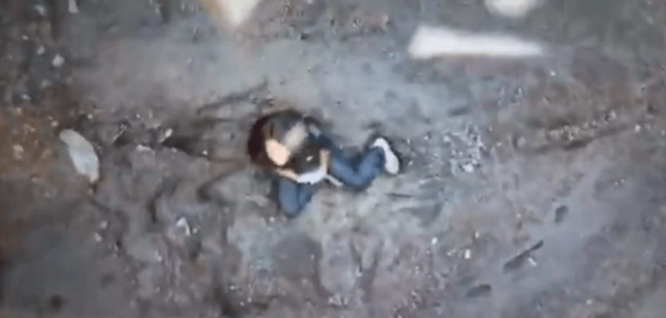 Person lying on the ground.