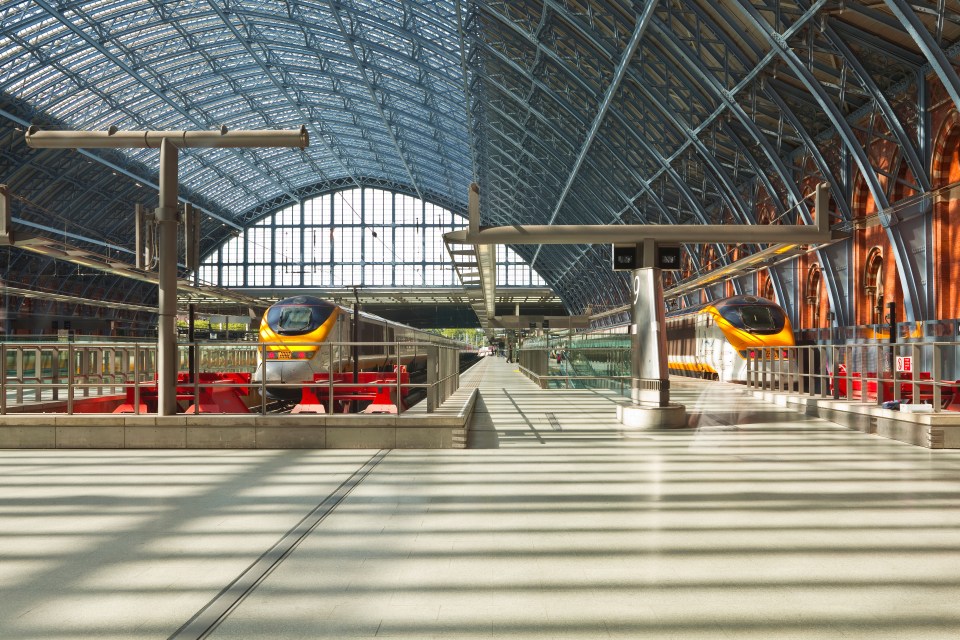 Two Eurostar trains at St. Pancras International station.