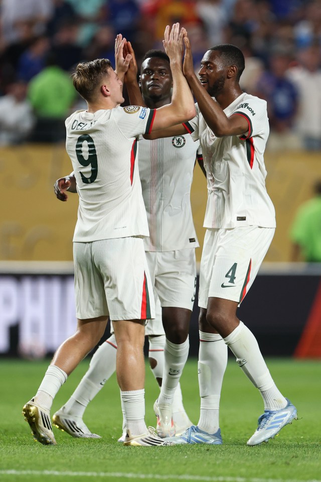 Chelsea FC players celebrating a goal.