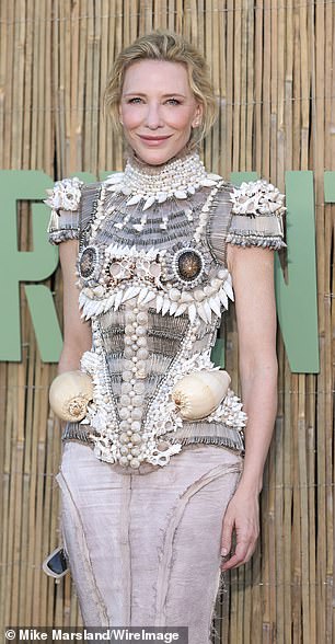 Cate Blanchett opted for a very quirky corset style top made out of sea shells and frayed faded knee length skirt and nude heels