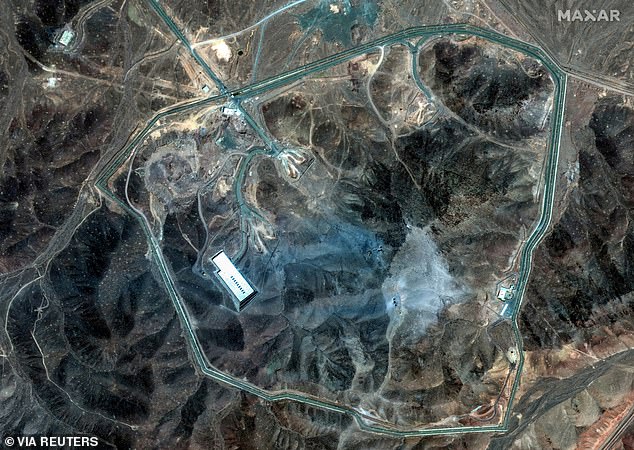 A satellite view shows an overview of Fordow underground complex, after the U.S. struck the underground nuclear facility, near Qom, Iran June 22, 2025. Several craters can be seen where US GBU-57 massive ordnance penetrator munitions were dropped, with dirt and concrete spread over the facility