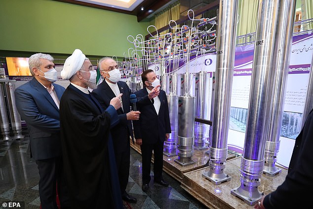 Iran's former president Hassan Rouhani is seen inspecting nuclear facility components in 2021