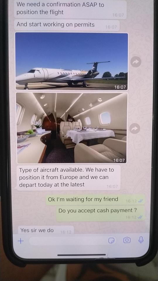 Phone screen showing messages arranging a private jet charter.