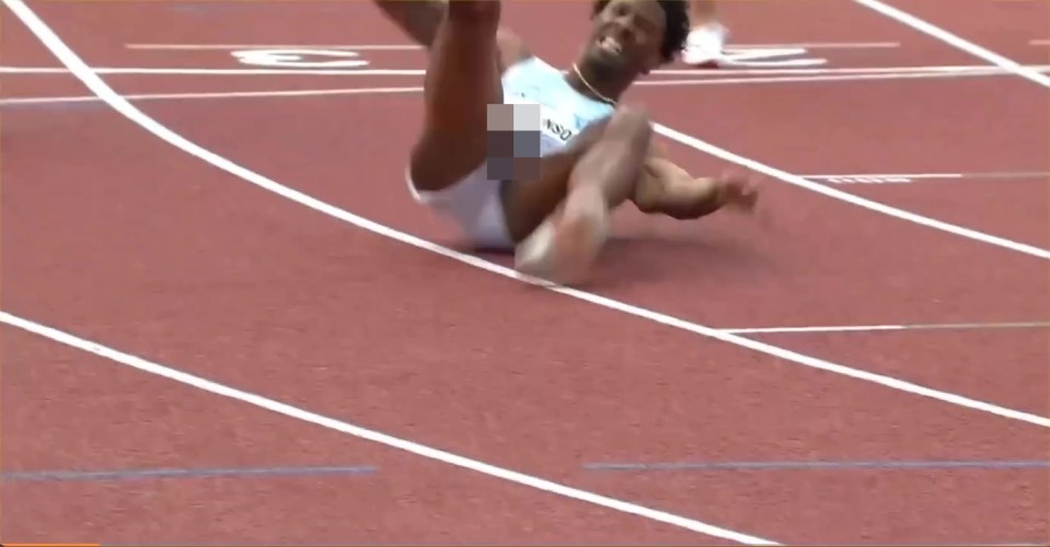 Runner falling on a track.