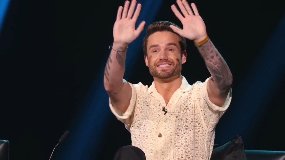 Liam Payne waving on the set of Building the Band.