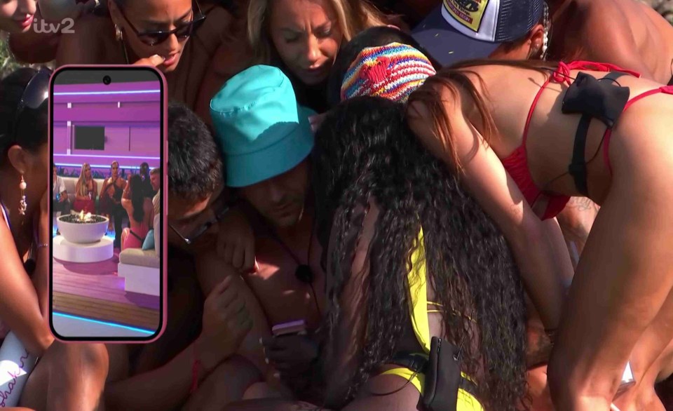 Islanders watching a video on a phone.