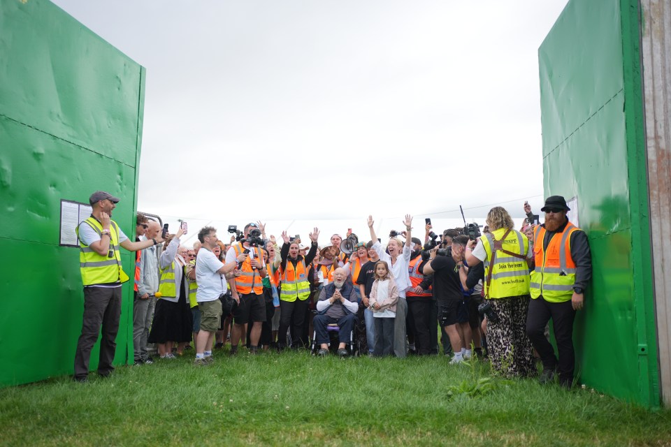 Emily Eavis opening the gates at the Glastonbury Festival.