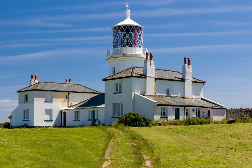 2GCE5XA The old lighthouse building (built 1829) on the clifftops at Caldey Island off the coast of Wales, UK