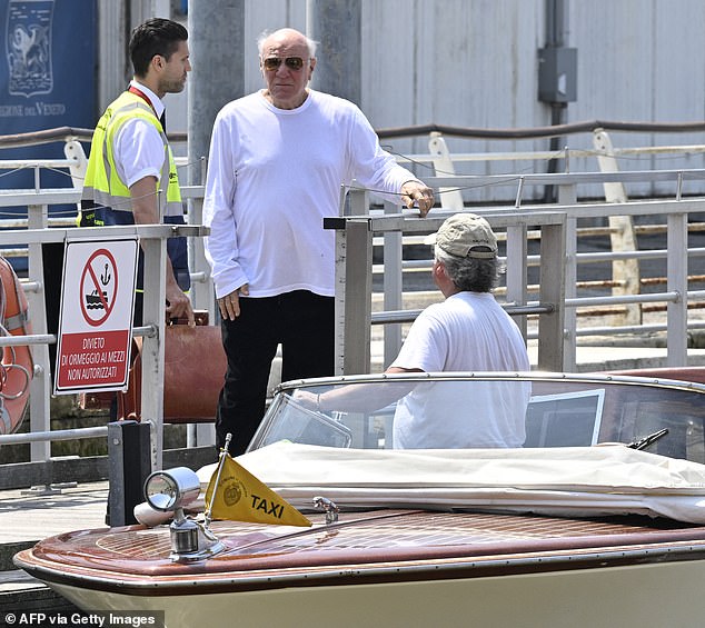 The US businessman boarded a taxi-boat - as celebrities prepare to sail into Venice on their superyachts