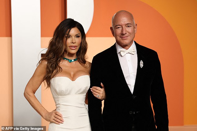 CEO of Amazon Jeff Bezos and partner Lauren Sanchez attend the Vanity Fair Oscar Party at the Wallis Annenberg Center for the Performing Arts in Beverly Hills, California, on March 2, 2025