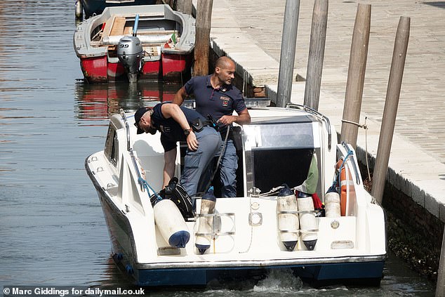 Private security are seen patrolling the area of where the wedding events will be held