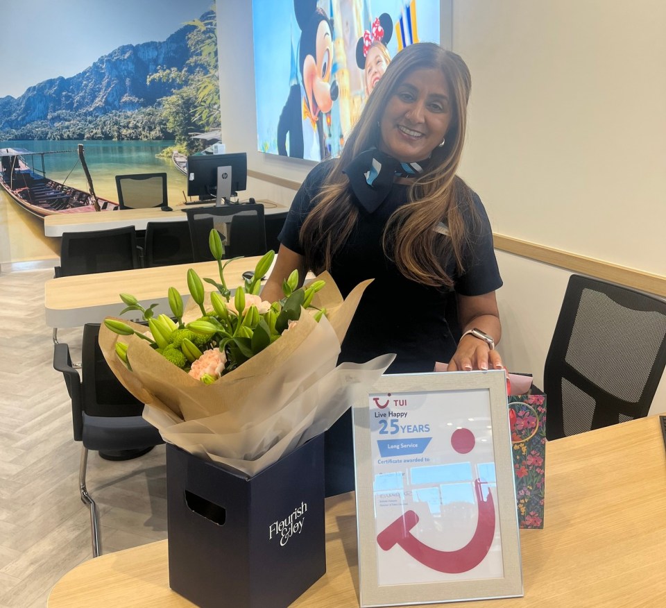 Employee receiving 25-year service award.
