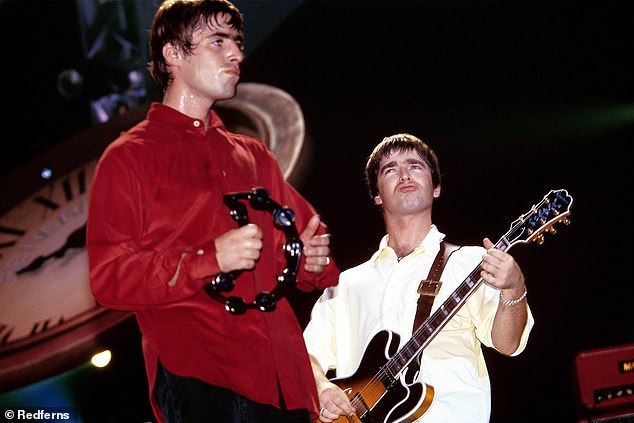 Warring brothers Liam and Noel Gallagher became household names with Oasis following the release of debut album Definitely Maybe in 1994 (pictured onstage in 1997)