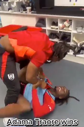 Adama Traore wins a playful wrestling match.