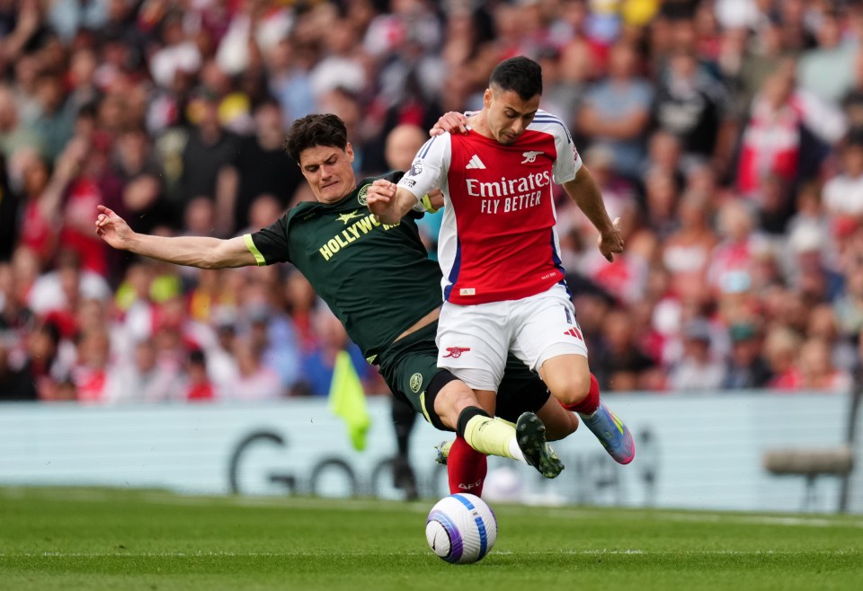 Brentford's Christian Norgaard fouling Arsenal's Gabriel Martinelli during a Premier League match.