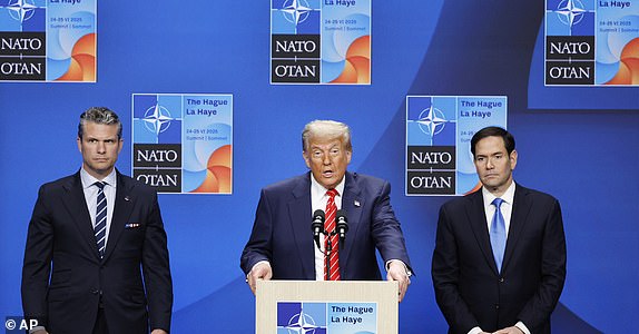 President Donald Trump, center, speaks during a media conference at the NATO summit in The Hague, Netherlands, Wednesday, June 25, 2025. (AP Photo/Matthias Schrader)