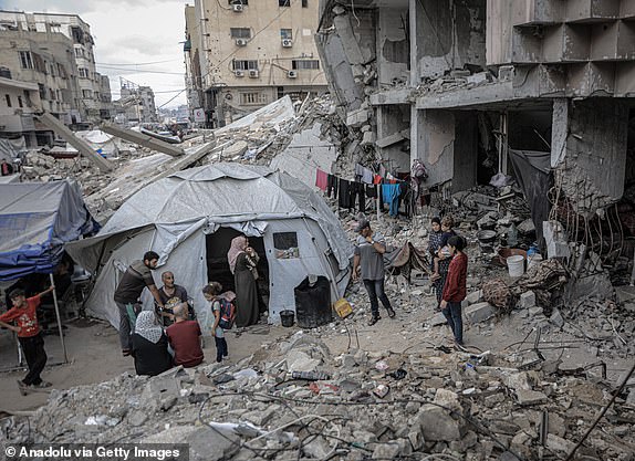JABALIA, GAZA - JUNE 24: Deprived of basic needs such as shelter, food and clean water, Palestinians continue their daily life in makeshift tents and the rubble of collapsed buildings, where they live under difficult living conditions in Jabalia, Gaza on June 24, 2025. The humanitarian crisis experienced by Gazans trying to survive in tents or on the rubble of collapsed buildings is escalating day by day due to Israel's attacks and blockade. (Photo by Ahmed Jihad Ibrahim Al-arini/Anadolu via Getty Images)