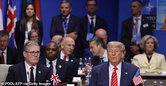 Britain's Prime Minister Keir Starmer (L) and US President Donald Trump attend the North Atlantic Council plenary meeting at the North Atlantic Treaty Organisation (NATO) summit in The Hague on June 25, 2025.  (Photo by Ludovic MARIN / POOL / AFP) (Photo by LUDOVIC MARIN/POOL/AFP via Getty Images)