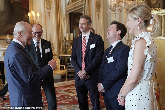 Will Straw (third right), Declan Donnelly (centre) and his wife Alison pictured speaking to the King