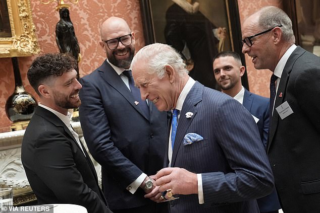 At one point, the King - sporting a pin-stripe suit for the occasion - appeared to be in fits of laughter