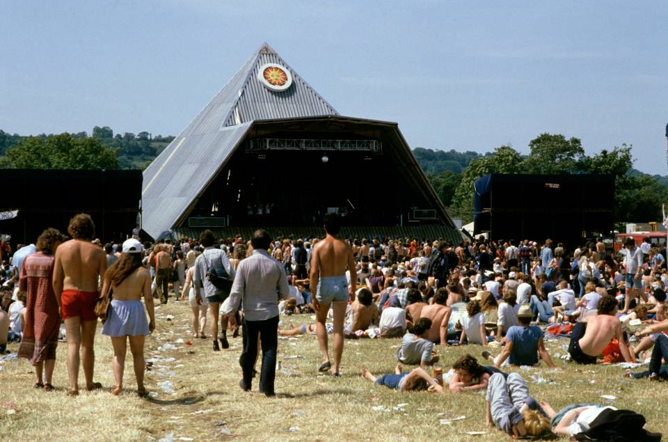 Large crowd at Glastonbury Festival in front of the Pyramid Stage.
