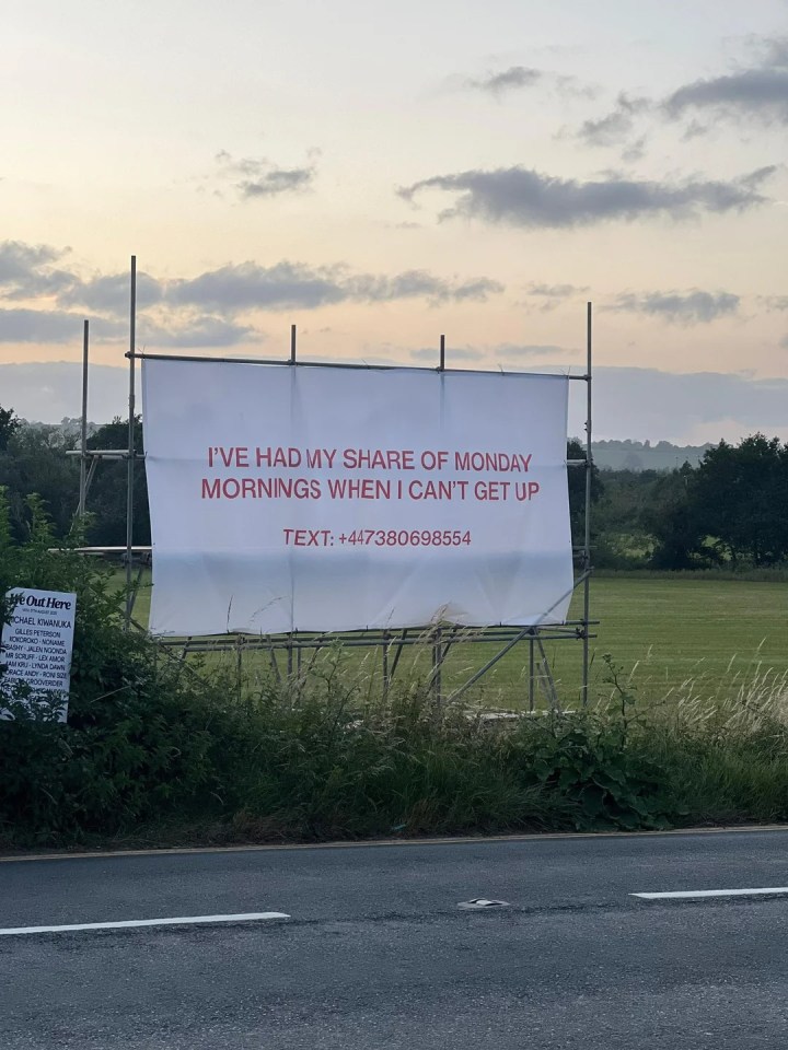 Billboard with text: "I've had my share of Monday mornings when I can't get up. Text: +447380698554"