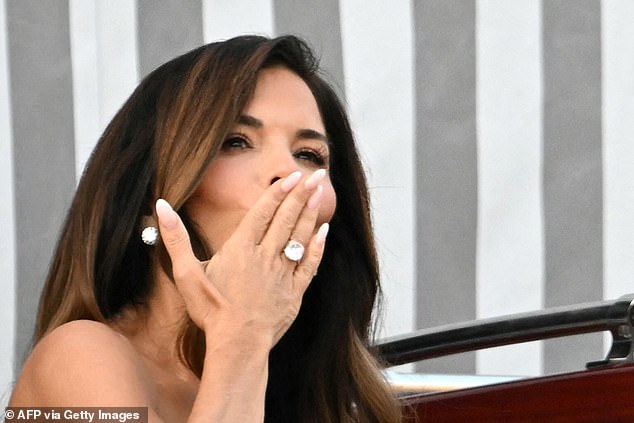 Lauren Sanchez shows off her enormous ring to crowds outside the Aman Hotel