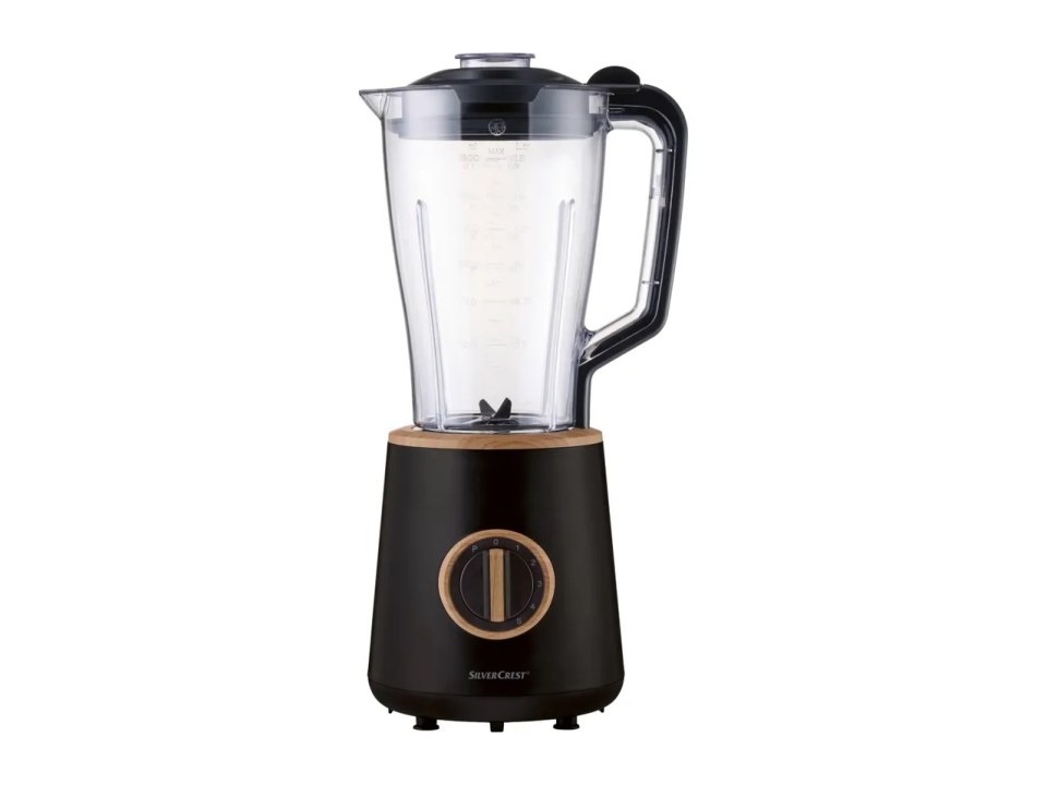 Black blender with a clear jar and wood accents.