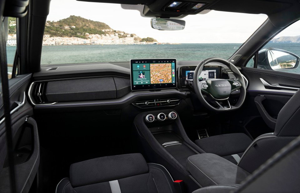 Skoda car interior with touchscreen display.