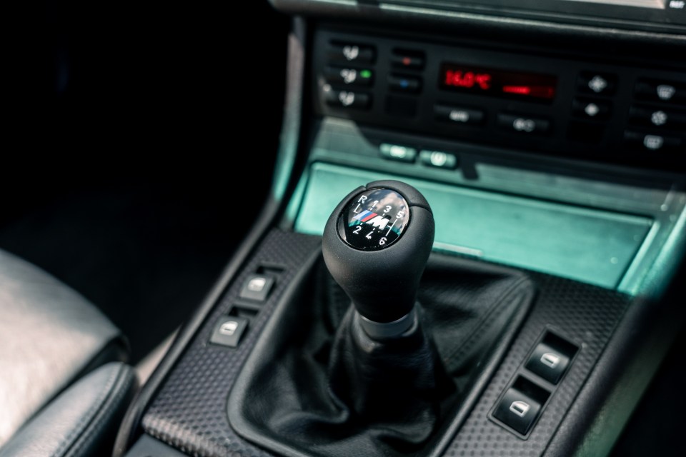 Close-up of a car's gear stick.