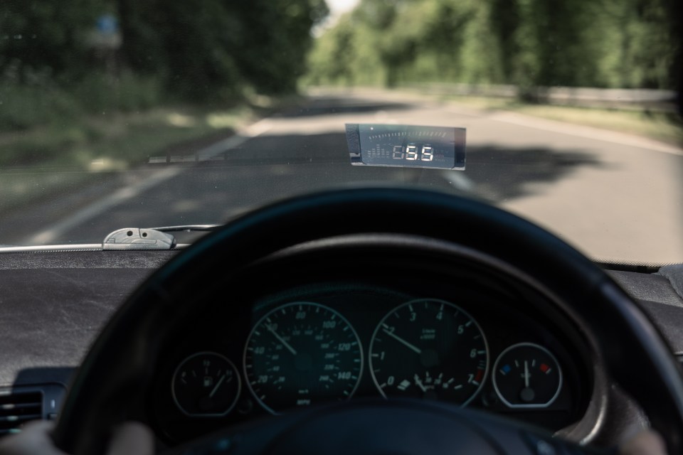 Car dashboard showing a speed of 88.8 mph.