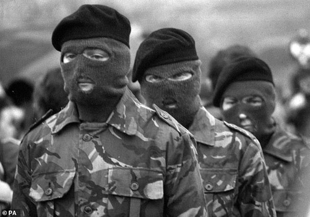 Pictured: Masked members of the Irish Republican Army (IRA) escorting the coffin of Bobby Sands, who died on hunger strike at HMP Prison Maze in Northern Ireland